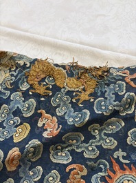 A Chinese silk blue-ground summer gauze 'Dragons' robe, 19th C.