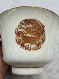 A fine Chinese iron-red gilt-decorated covered teabowl with a stand, Guangxu mark and of the period