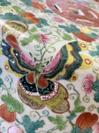 A Chinese famille rose garden seat with butterflies, flowers and fruiting branches, 19th C.