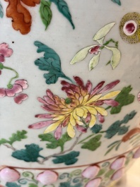 A Chinese famille rose garden seat with butterflies, flowers and fruiting branches, 19th C.