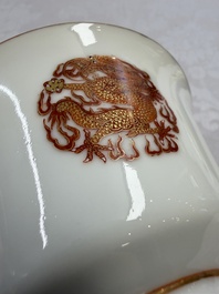A fine Chinese iron-red gilt-decorated covered teabowl with a stand, Guangxu mark and of the period
