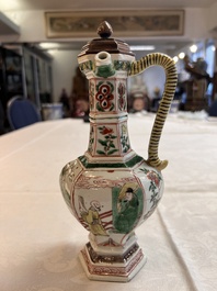 A rare Chinese famille verte puzzle jug with a wooden cover, Kangxi