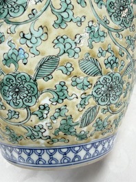 A rare pair of Chinese famille verte yellow-ground 'Flower Scroll' covered vases, Kangxi