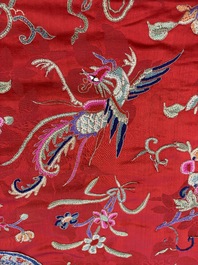 A Chinese embroidered silk red-ground women's robe, 19th C.