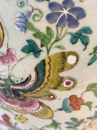 A Chinese famille rose garden seat with butterflies, flowers and fruiting branches, 19th C.