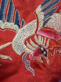 A Chinese embroidered silk red-ground women's robe, 19th C.