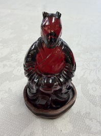 A rare complete set of 12 Chinese cherry amber 'Zodiac' figures on wooden stands, Qianlong mark, Republic