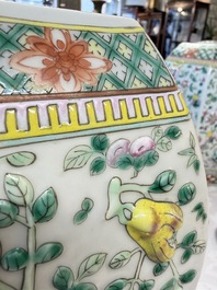 A pair of Chinese famille rose 'Antiquities' vases and covers, 19th C.