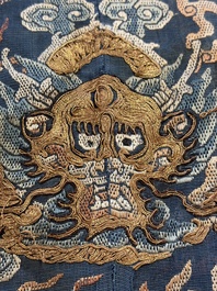 A Chinese silk blue-ground summer gauze 'Dragons' robe, 19th C.