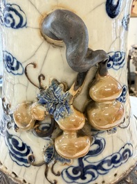 A pair of Chinese blue and white Nanking crackle-glazed 'Dragons' vases, 19th C.