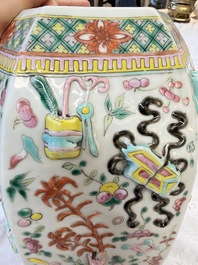 A pair of Chinese famille rose 'Antiquities' vases and covers, 19th C.