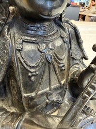 A fine Chinese bronze figure of Bodhisattva holding a ruyi, Ming