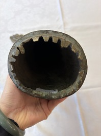 A rare and large Tibetan bronze forearm of a Buddhist figure with a chakra design, on a later metal stand, Qing