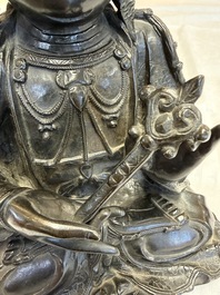 A fine Chinese bronze figure of Bodhisattva holding a ruyi, Ming