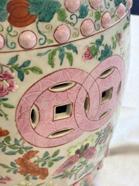 A Chinese famille rose garden seat with butterflies, flowers and fruiting branches, 19th C.