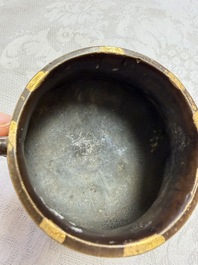 A Chinese gold-splashed bronze censer with two handles, Xuande mark, 18th C.