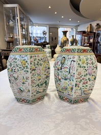 A pair of Chinese famille rose 'Antiquities' vases and covers, 19th C.