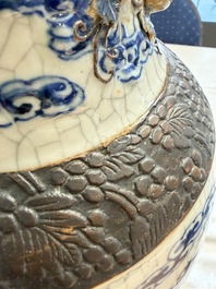 A pair of Chinese blue and white Nanking crackle-glazed 'Dragons' vases, 19th C.