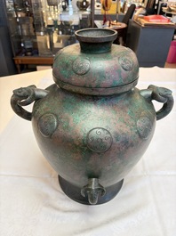 A large Chinese archaistic bronze wine vessel and cover with ram-form handles, Lei 罍, Ming