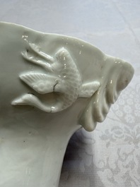 A very large Chinese Dehua blanc de Chine libation cup with a dragon, a qilin, a tiger and a crane, 18th C.