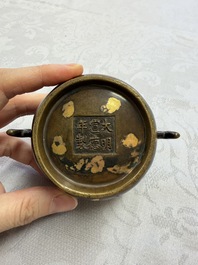 A Chinese gold-splashed bronze censer with two handles, Xuande mark, 18th C.