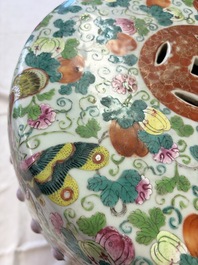 A Chinese famille rose garden seat with butterflies, flowers and fruiting branches, 19th C.