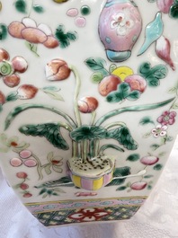 A pair of Chinese famille rose 'Antiquities' vases and covers, 19th C.