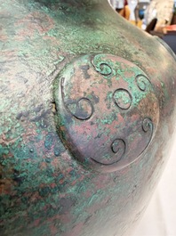 A large Chinese archaistic bronze wine vessel and cover with ram-form handles, Lei 罍, Ming