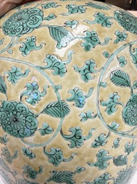 A rare pair of Chinese famille verte yellow-ground 'Flower Scroll' covered vases, Kangxi