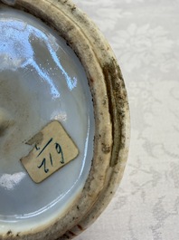 A pair of Chinese famille rose 'Antiquities' vases and covers, 19th C.