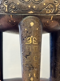 A rare Chinese gold- and silver-inlaid bronze 'Ding' censer with Taotie design on a hongmu stand, Shaosheng 紹聖 and Su Zhe 蘇轍 mark, Song or later