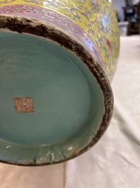 A pair of large Chinese famille rose yellow-ground 'Hu' vases with narrative design, Qianlong mark, Republic