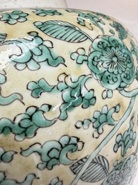 A rare pair of Chinese famille verte yellow-ground 'Flower Scroll' covered vases, Kangxi