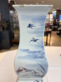 A Chinese blue, white and copper-red 'Birds among Flowering Branches' square gourd vase, 19th C.