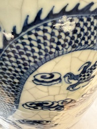A pair of Chinese blue and white Nanking crackle-glazed 'Dragons' vases, 19th C.