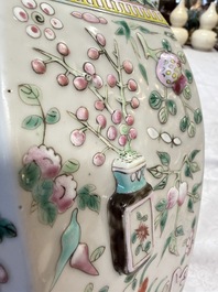 A pair of Chinese famille rose 'Antiquities' vases and covers, 19th C.