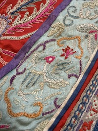 A Chinese embroidered silk red-ground women's robe, 19th C.