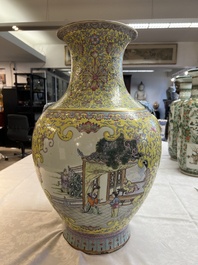 A pair of large Chinese famille rose yellow-ground 'Hu' vases with narrative design, Qianlong mark, Republic