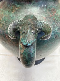 A large Chinese archaistic bronze wine vessel and cover with ram-form handles, Lei 罍, Ming