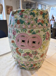 A Chinese famille rose garden seat with butterflies, flowers and fruiting branches, 19th C.