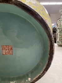 A pair of large Chinese famille rose yellow-ground 'Hu' vases with narrative design, Qianlong mark, Republic