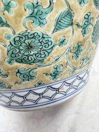 A rare pair of Chinese famille verte yellow-ground 'Flower Scroll' covered vases, Kangxi
