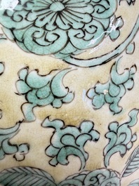 A rare pair of Chinese famille verte yellow-ground 'Flower Scroll' covered vases, Kangxi