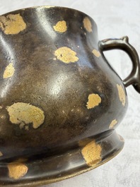A Chinese gold-splashed bronze censer with two handles, Xuande mark, 18th C.
