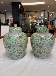 A rare pair of Chinese famille verte yellow-ground 'Flower Scroll' covered vases, Kangxi