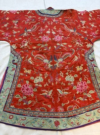 A Chinese embroidered silk red-ground women's robe, 19th C.