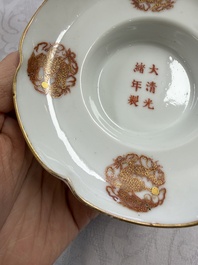 A fine Chinese iron-red gilt-decorated covered teabowl with a stand, Guangxu mark and of the period