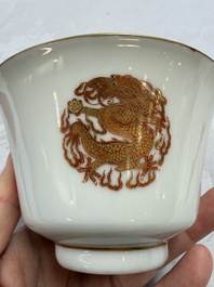 A fine Chinese iron-red gilt-decorated covered teabowl with a stand, Guangxu mark and of the period