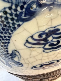 A pair of Chinese blue and white Nanking crackle-glazed 'Dragons' vases, 19th C.