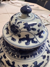 Two Chinese blue and white 'Lotus Scroll' vases and covers, Kangxi